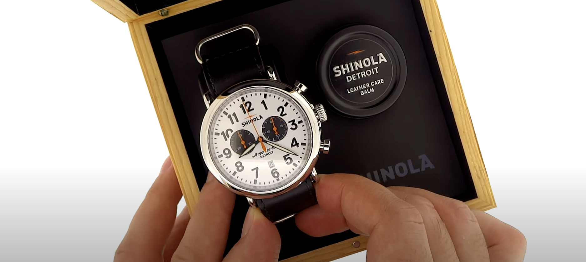 hand holding shinola watch ...